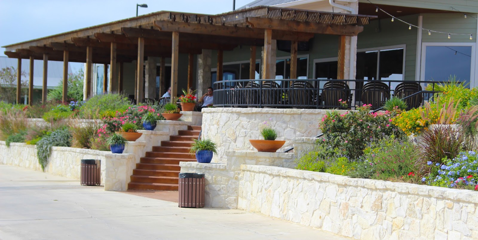 Morea Italian Steakhouse patio overlooking the golf course pond at sunset